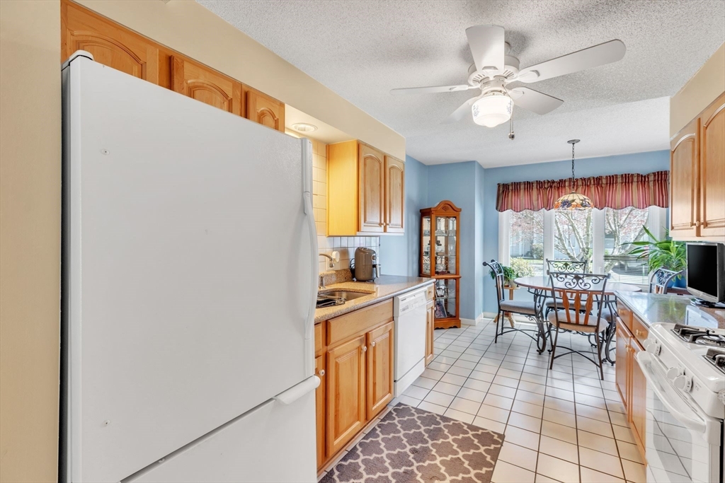 610 County Road, Unit 2 Holyoke, MA 01040 - Photo 8 of 42 a kitchen with a sink a counter top space and stainless steel appliances
