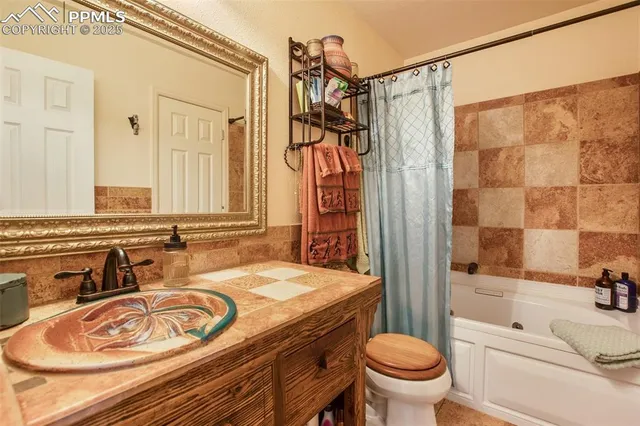 a bathroom with a sink mirror and vanity