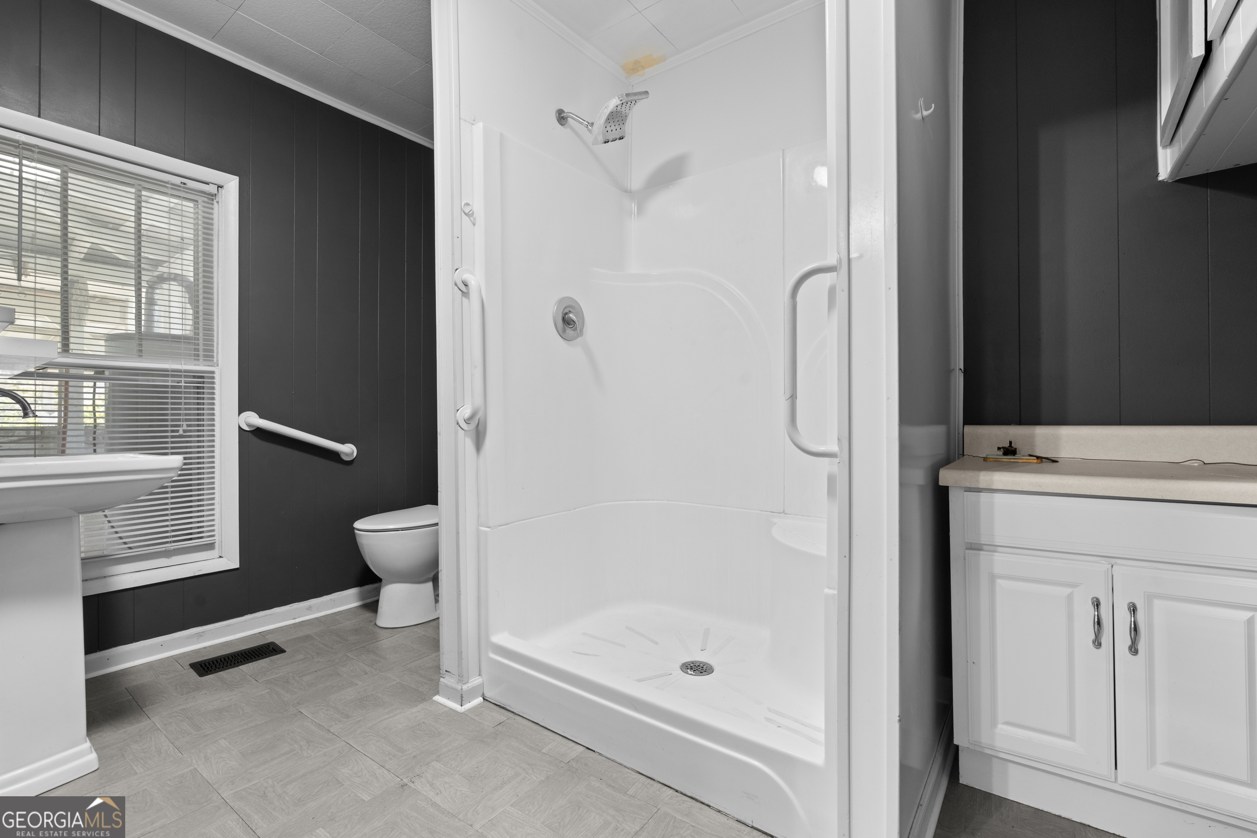 2 Finch Street Portal, GA 30450 - Photo 15 of 23 a bathroom with a granite countertop shower a toilet and a sink