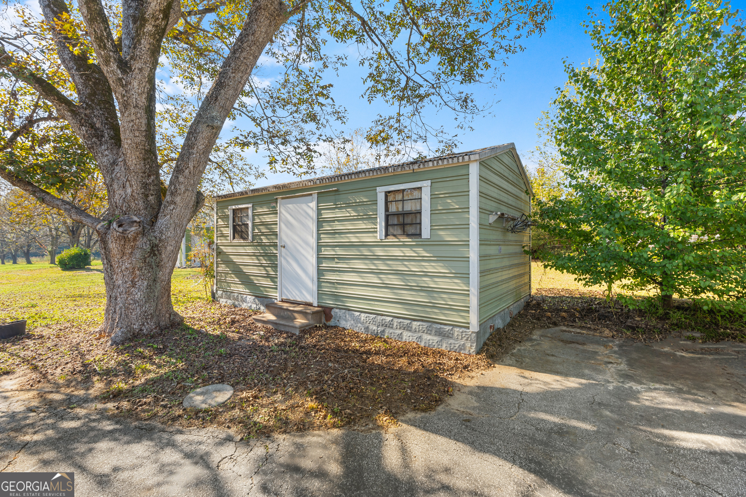 2 Finch Street Portal, GA 30450 - Photo 21 of 23 a view of a house with a tree in the yard