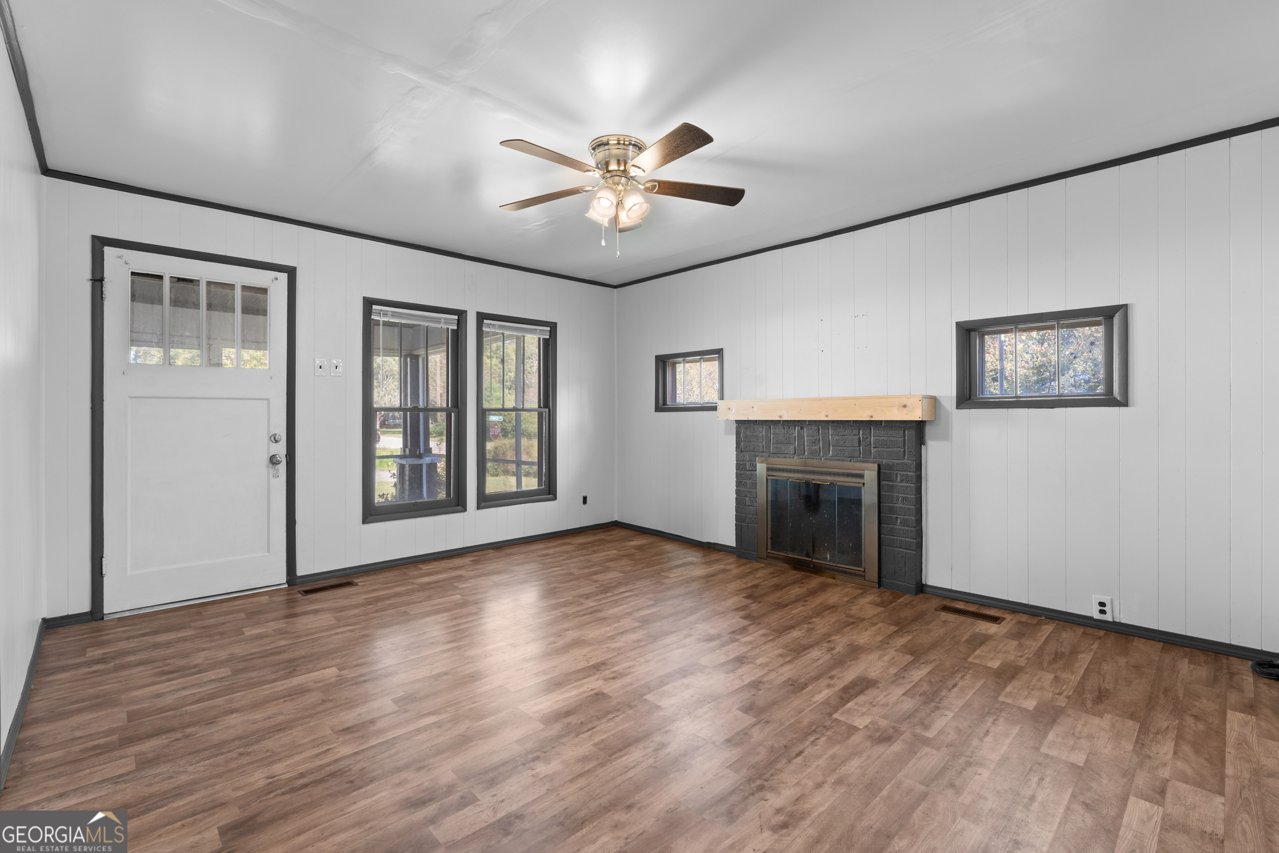 2 Finch Street Portal, GA 30450 - Photo 4 of 23 a view of an empty room with window and wooden floor