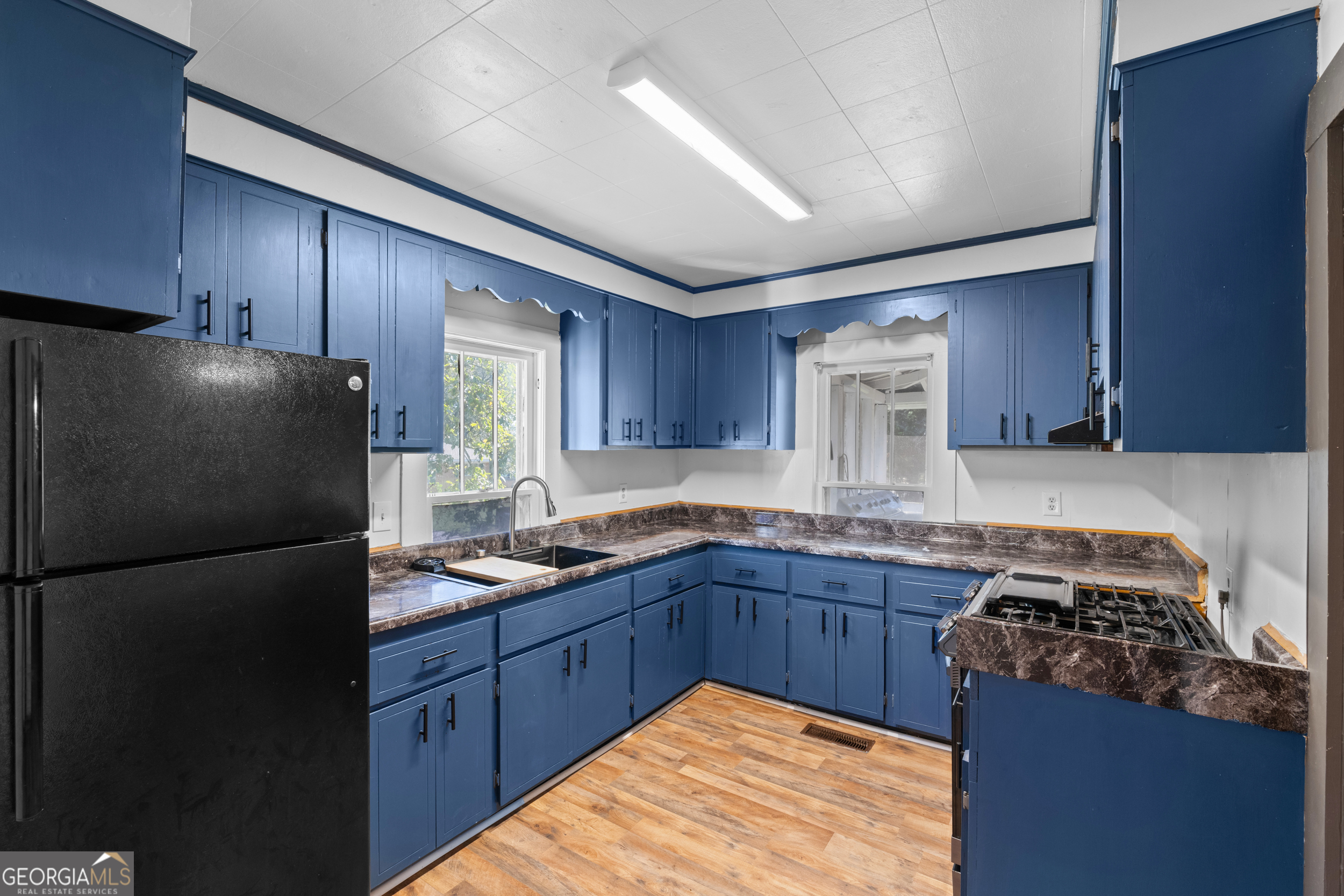 2 Finch Street Portal, GA 30450 - Photo 7 of 23 a kitchen with stainless steel appliances granite countertop a stove a refrigerator a sink and dishwasher