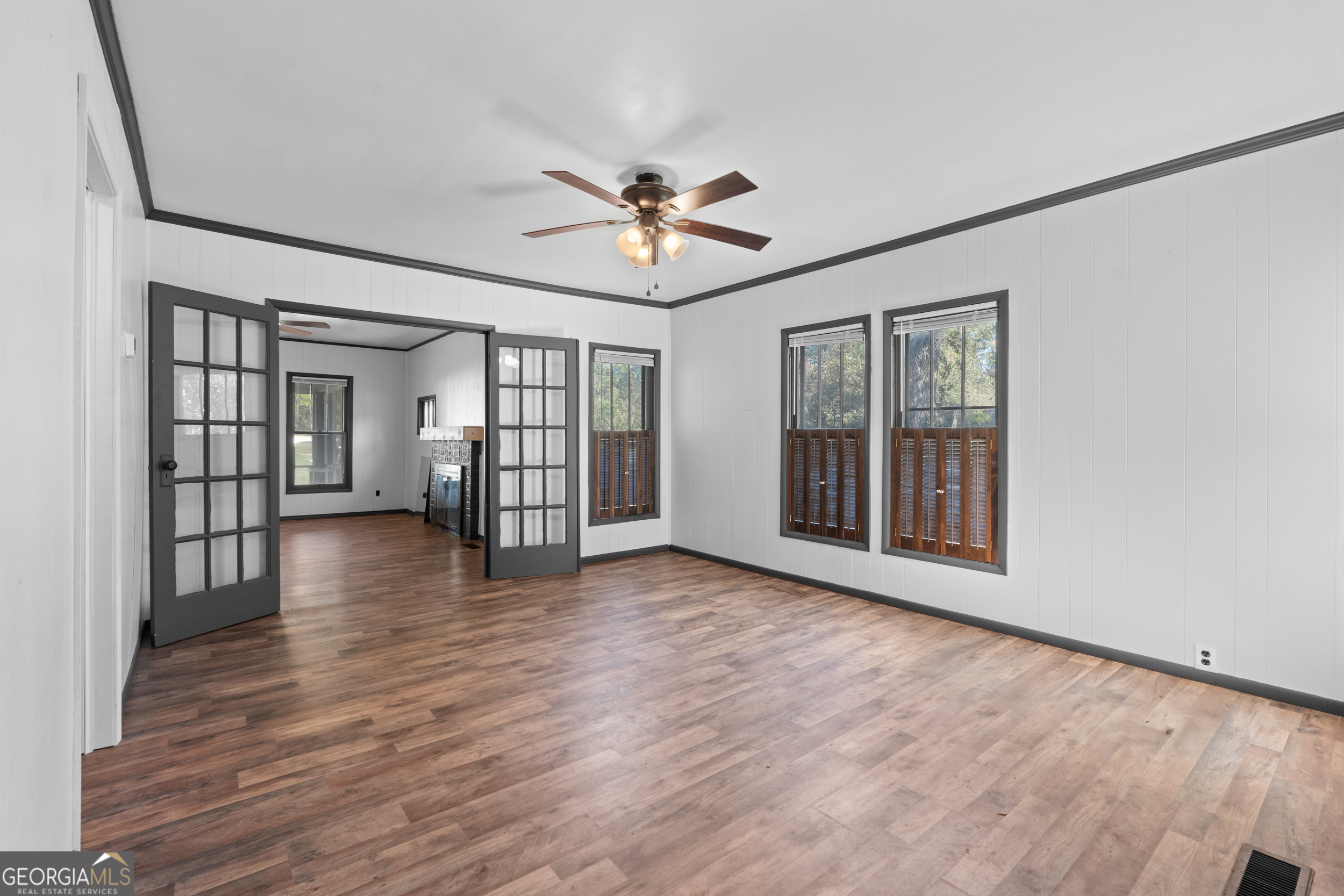 2 Finch Street Portal, GA 30450 - Photo 8 of 23 a view of an empty room with wooden floor and a window