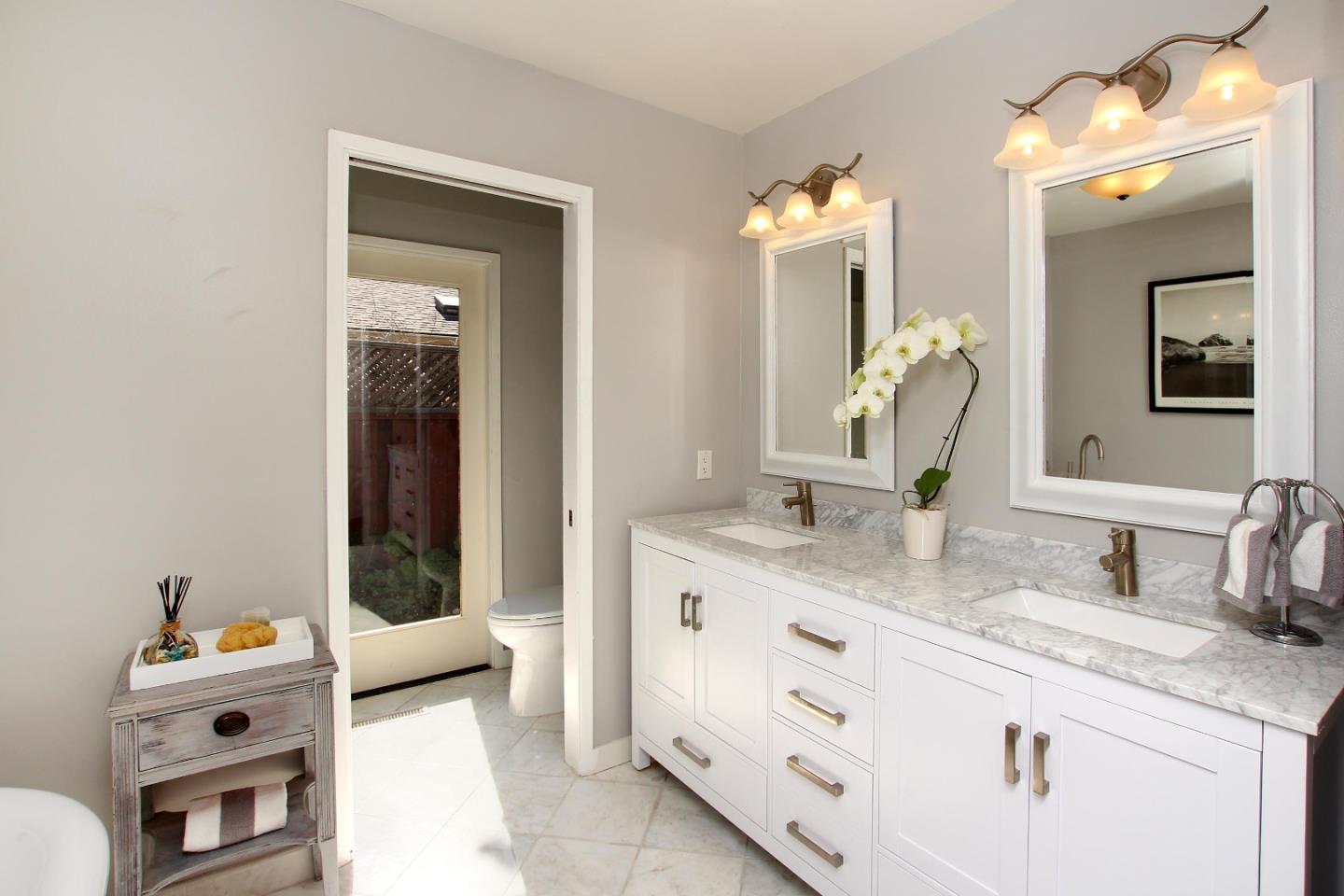 11 Oak Road Santa Cruz, CA 95060 - Photo 29 of 57 a en suite bathroom with a granite countertop sink and a mirror