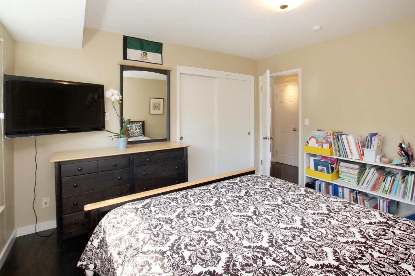 11 Oak Road Santa Cruz, CA 95060 - Photo 32 of 57 a bedroom with a bed and a flat screen tv