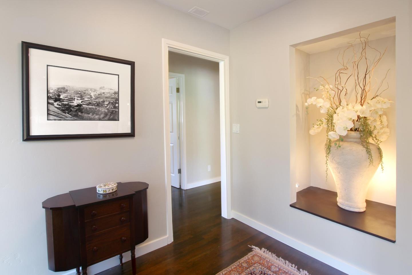 11 Oak Road Santa Cruz, CA 95060 - Photo 7 of 57 a view of a hallway with wooden floor and a lamp on a table