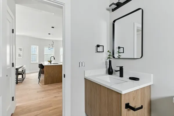 a bathroom with a sink and a mirror