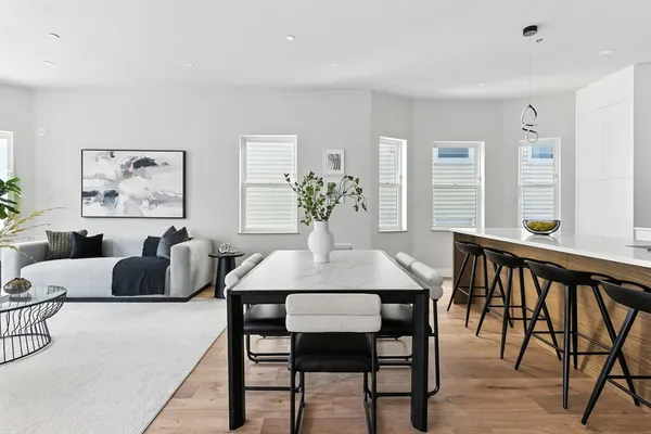 a dining room with furniture and window
