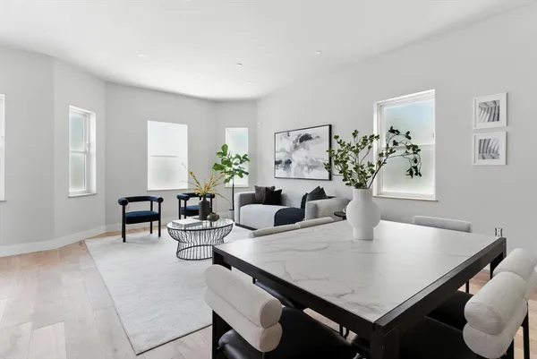a view of a dining room with furniture and window