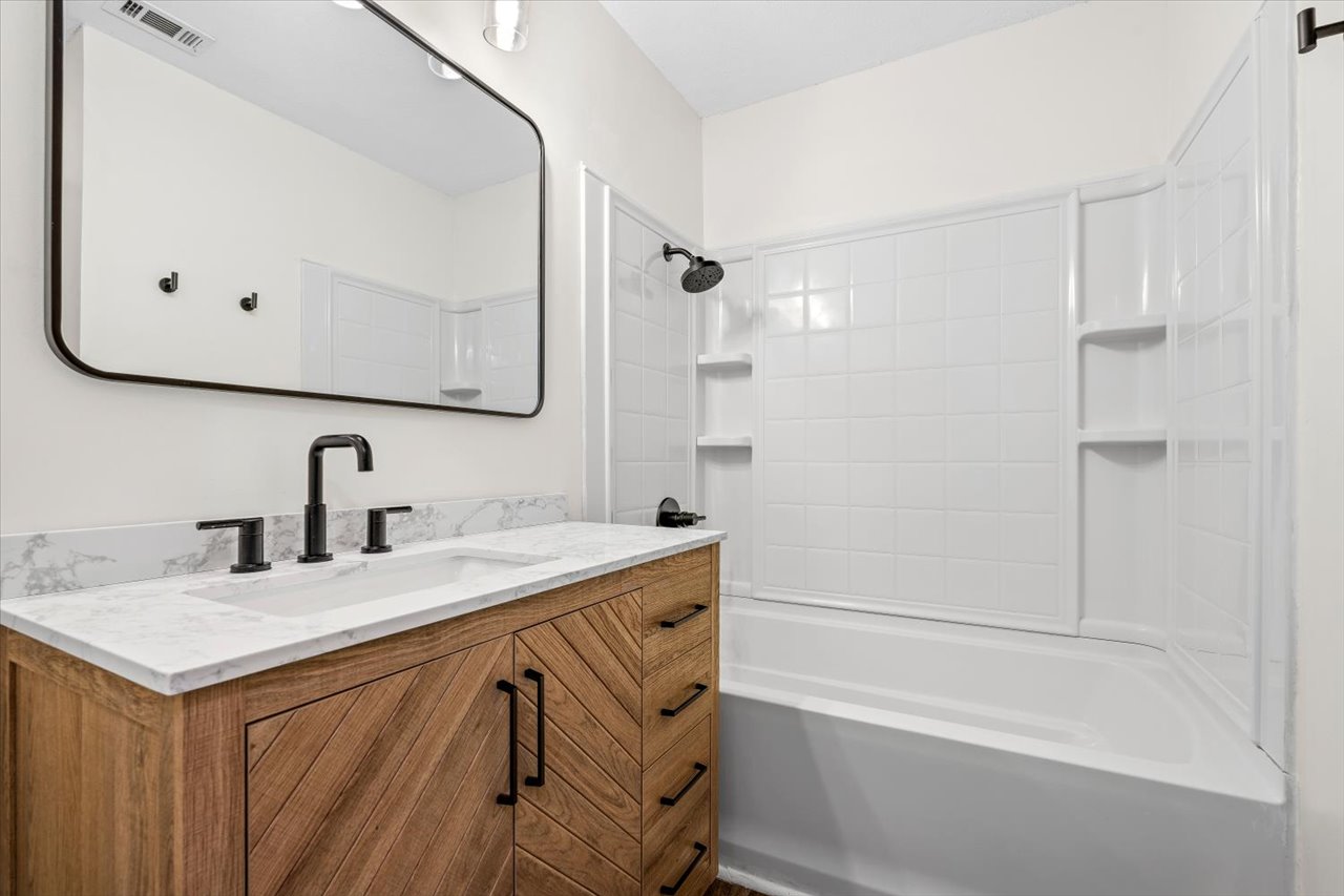 4004 Danli Lane Austin, TX 78749 - Photo 15 of 40 a bathroom with a sink and a mirror