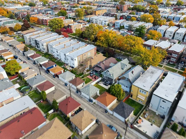 an aerial view of a city with lots of residential buildings