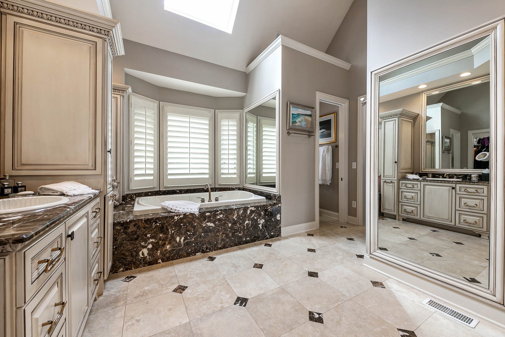992 Sylvan Circle Naperville, IL 60540 - Photo 18 of 36 a spacious bathroom with a tub sink shower and mirror