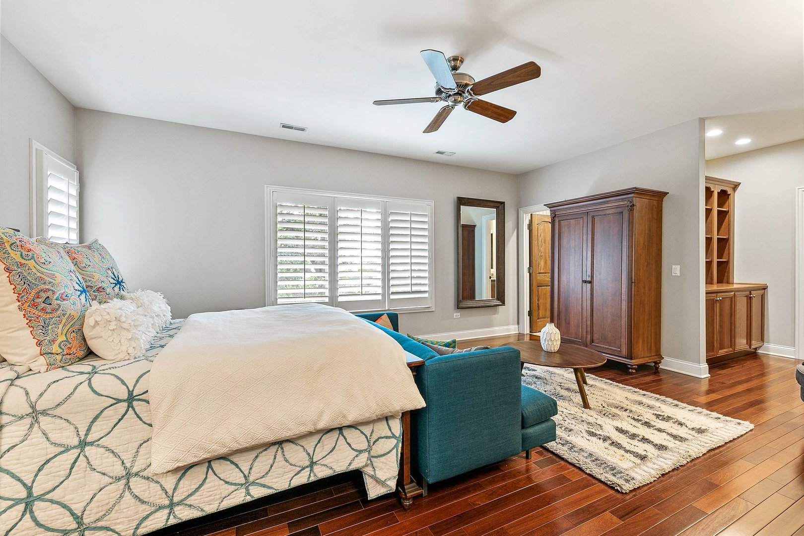 992 Sylvan Circle Naperville, IL 60540 - Photo 21 of 36 a bedroom with a bed and wooden floor