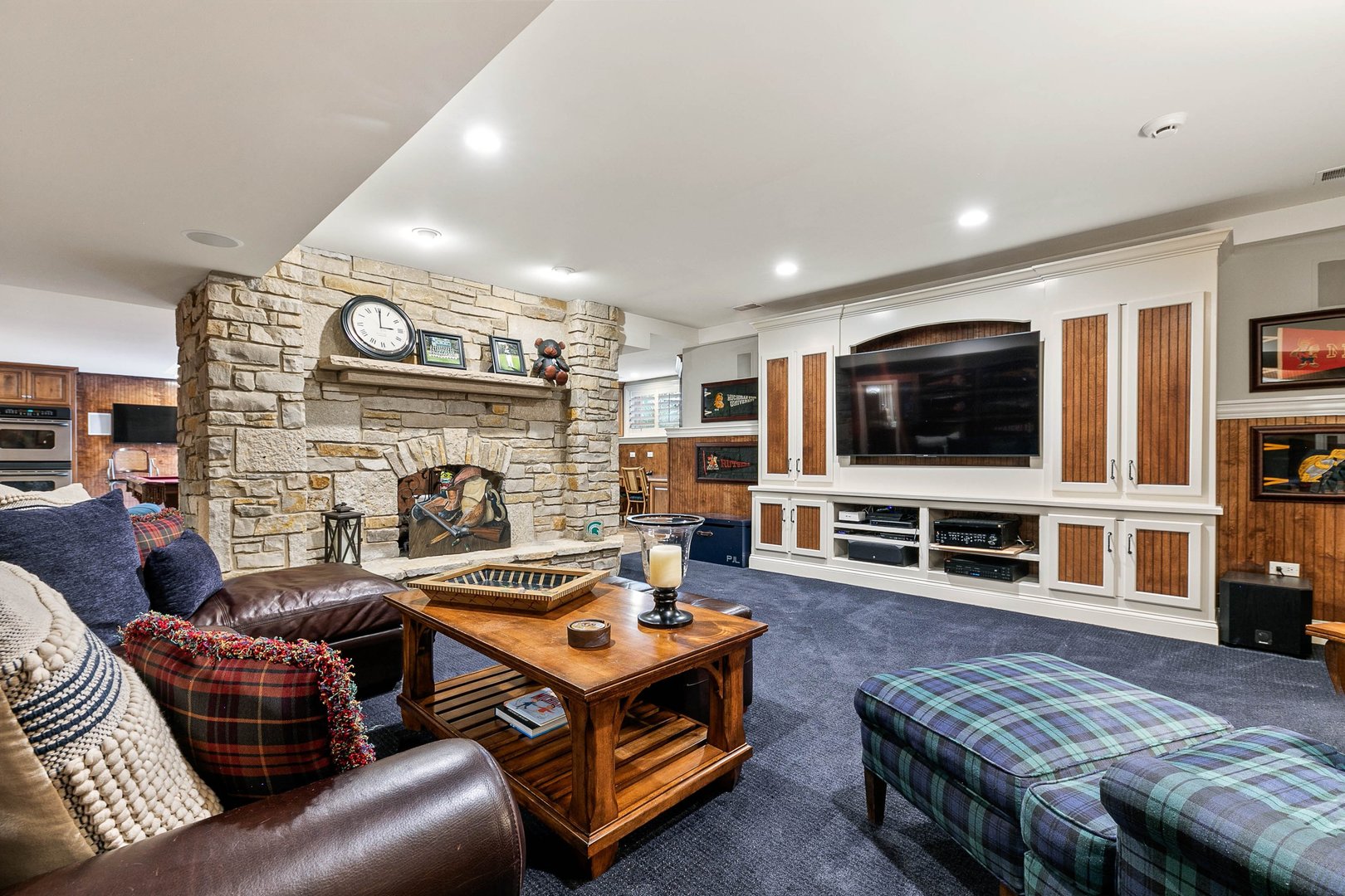 992 Sylvan Circle Naperville, IL 60540 - Photo 23 of 36 a living room with furniture and a flat screen tv