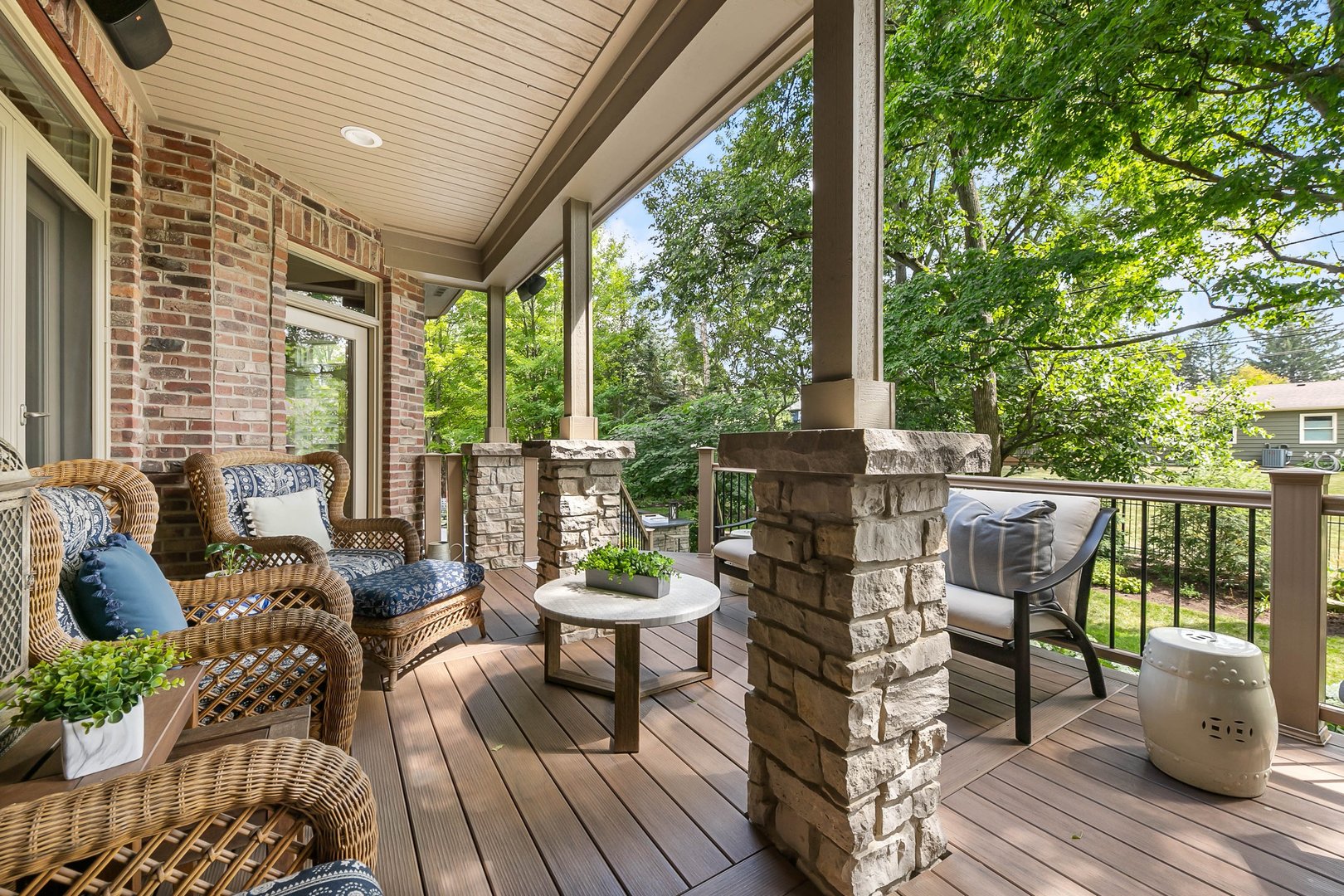 992 Sylvan Circle Naperville, IL 60540 - Photo 29 of 36 a view of a patio with couches chairs potted plants and floor to ceiling window