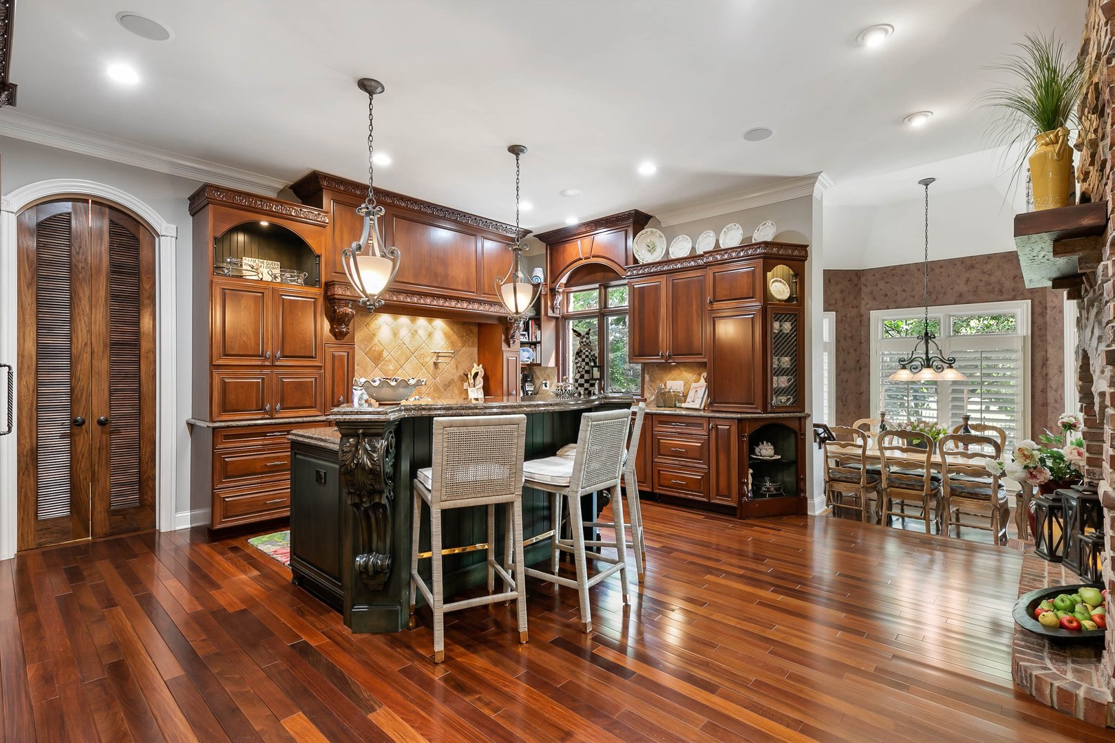 992 Sylvan Circle Naperville, IL 60540 - Photo 4 of 36 a kitchen with stainless steel appliances granite countertop a refrigerator a stove and a wooden floors