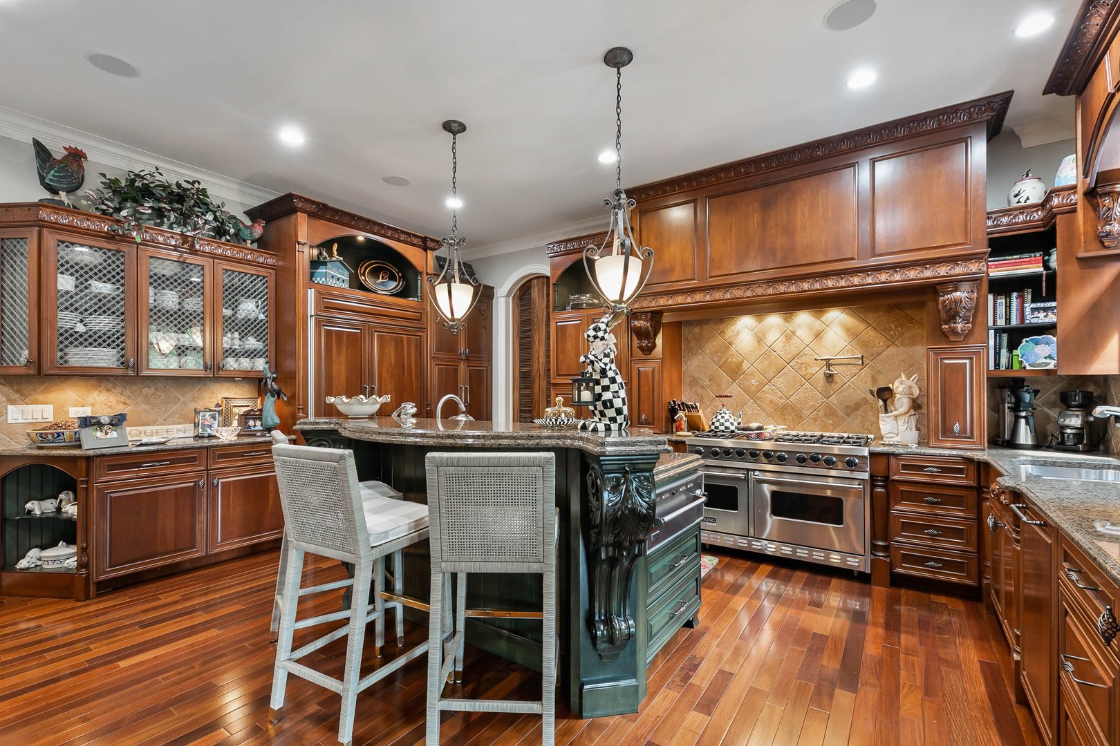 992 Sylvan Circle Naperville, IL 60540 - Photo 5 of 36 a kitchen with stainless steel appliances granite countertop a stove and a wooden floors