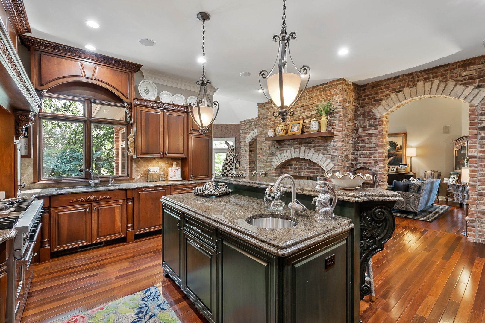 992 Sylvan Circle Naperville, IL 60540 - Photo 6 of 36 a kitchen with stainless steel appliances granite countertop a sink a stove and a wooden floors