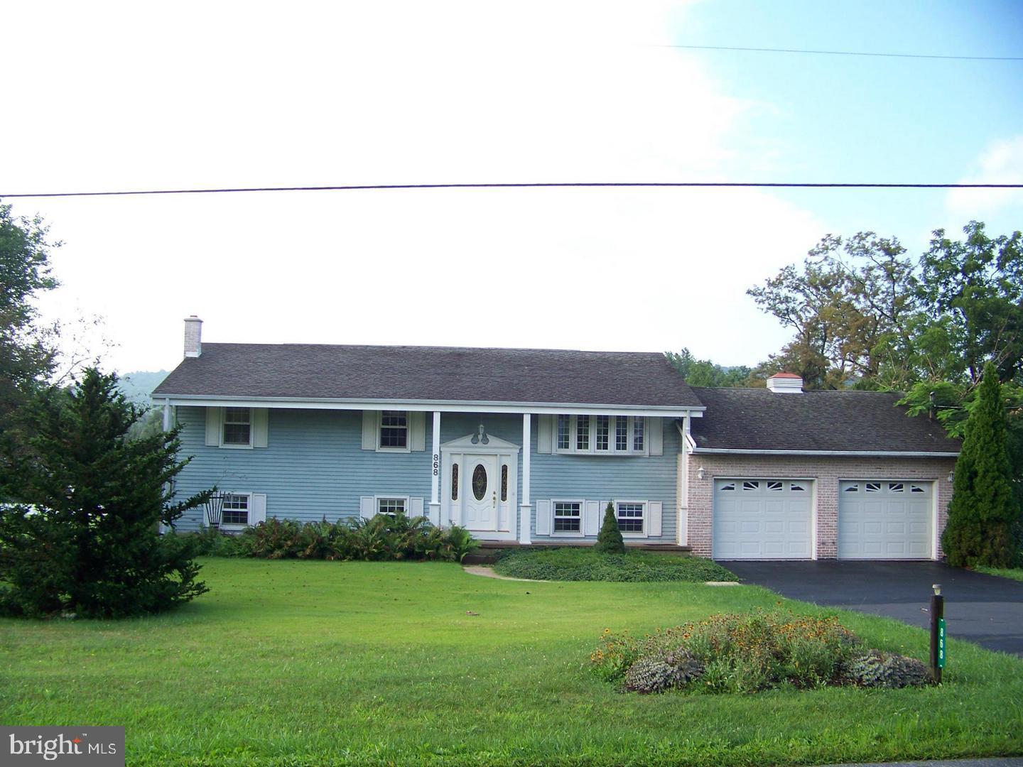 868 Siddonsburg Road Lewisberry, PA 17339 - Photo 1 of 1 a house view with a garden space