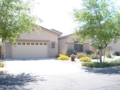 a view of a house with a yard and sitting area
