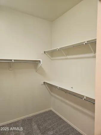a view of an empty walk in closet