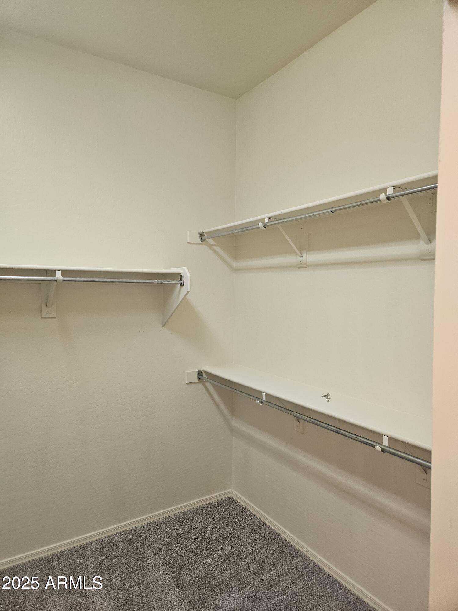 4692 South Calico Road Gilbert, AZ 85297 - Photo 13 of 29 a view of an empty walk in closet