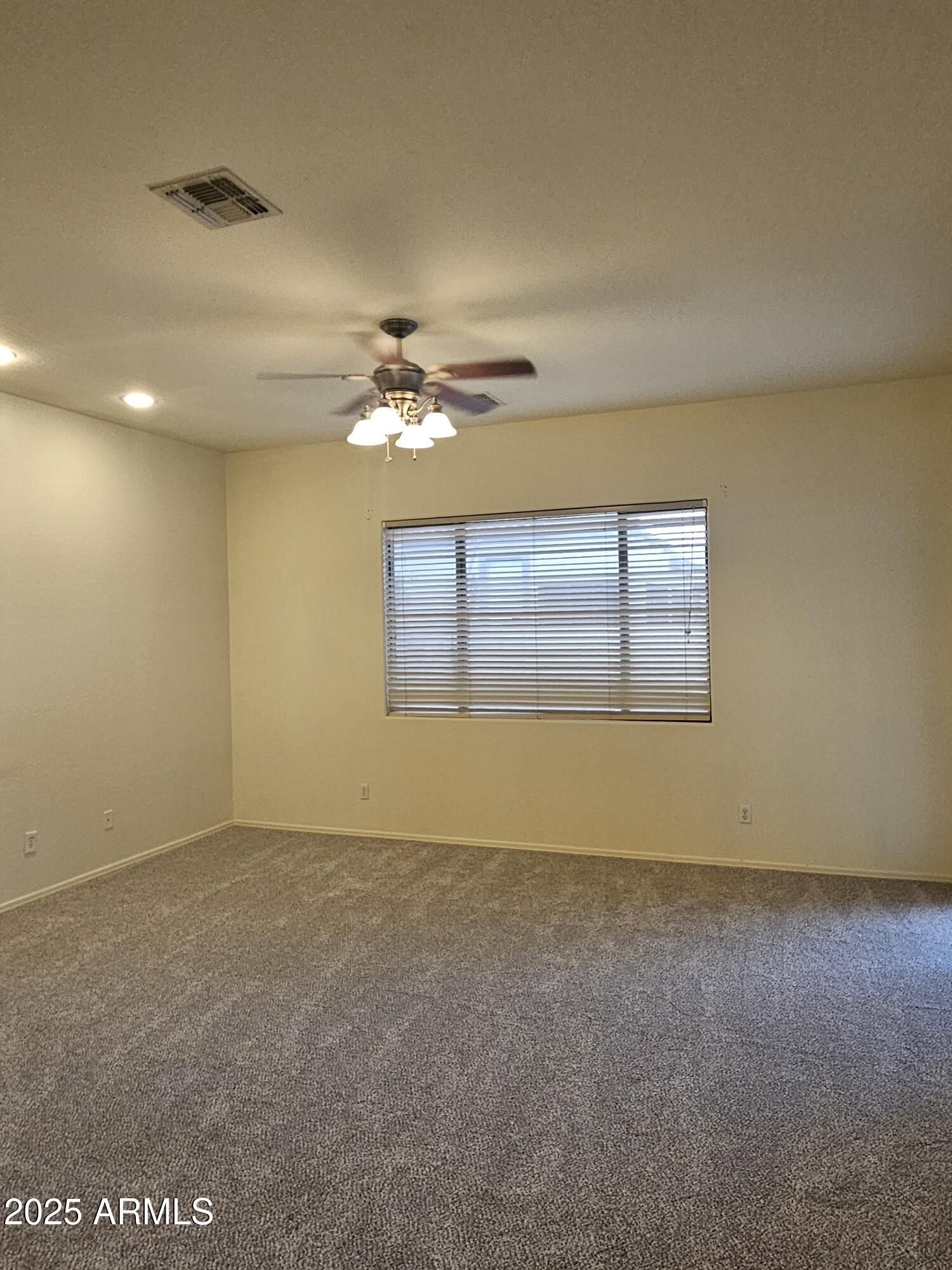 4692 South Calico Road Gilbert, AZ 85297 - Photo 19 of 29 a view of an empty room with a window