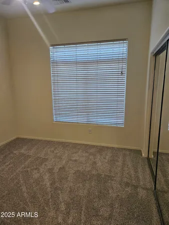 an empty room with closet area