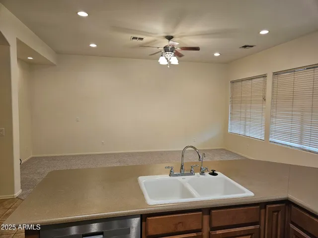 a bathroom with a sink and a window