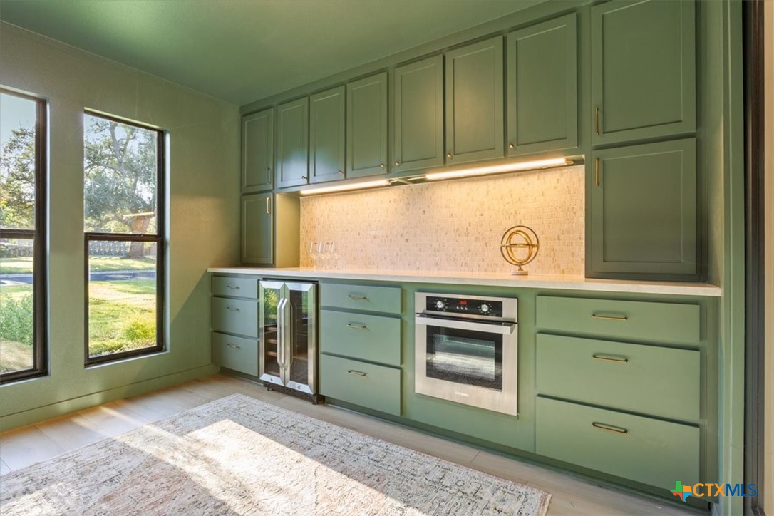 4306 Spanish Oak Road Temple, TX 76502 - Photo 15 of 36 a kitchen with cabinets appliances and a window