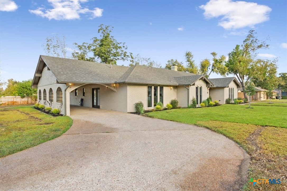 4306 Spanish Oak Road Temple, TX 76502 - Photo 2 of 36 a front view of a house with a yard and garage