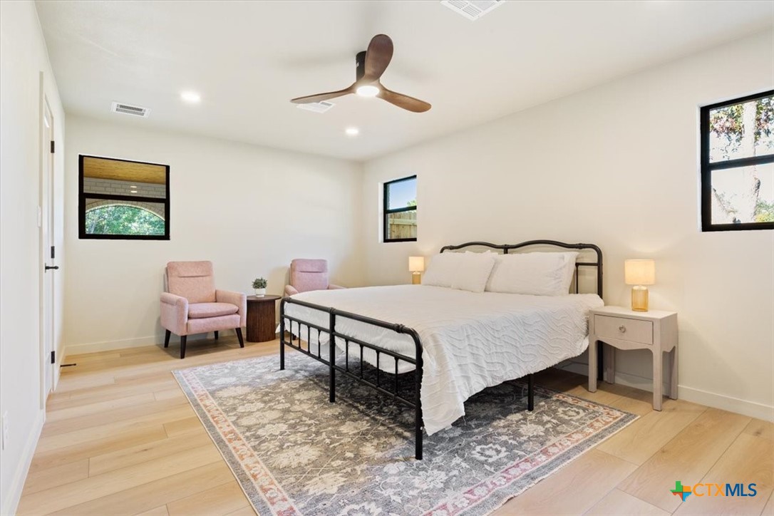 4306 Spanish Oak Road Temple, TX 76502 - Photo 23 of 36 a bedroom with a bed and glass table