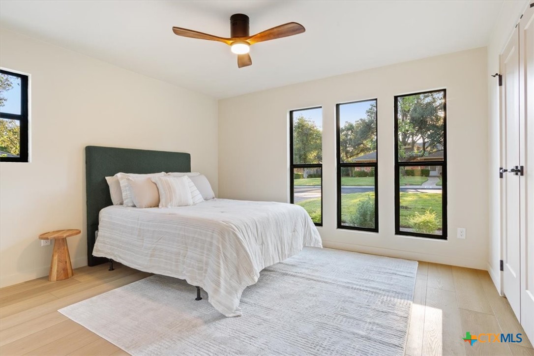 4306 Spanish Oak Road Temple, TX 76502 - Photo 25 of 36 a spacious bedroom with a large bed and a large window