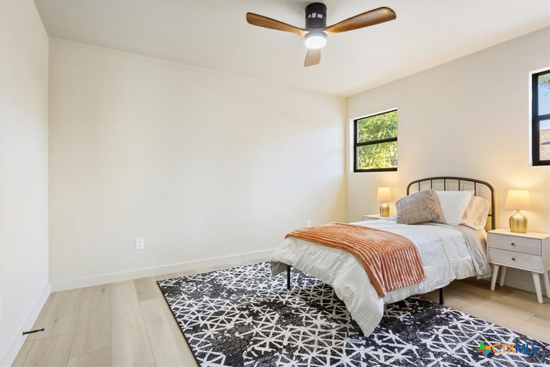 4306 Spanish Oak Road Temple, TX 76502 - Photo 26 of 36 a bedroom with a bed and a painting on the wall