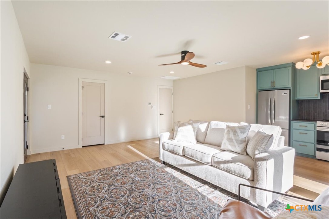 4306 Spanish Oak Road Temple, TX 76502 - Photo 28 of 36 a living room with furniture and a rug