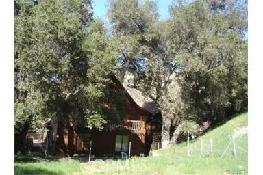 a view of house with yard