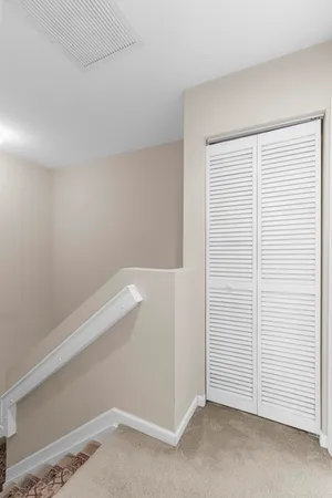 a bedroom with furniture and a flat screen tv