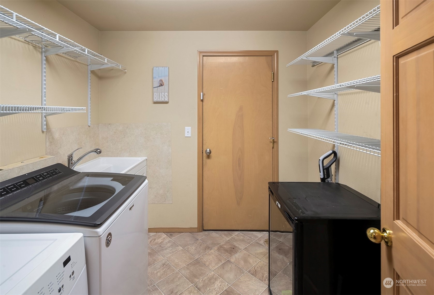 1601 Field Avenue Northeast Renton, WA 98059 - Photo 26 of 36 a kitchen with a sink and a refrigerator