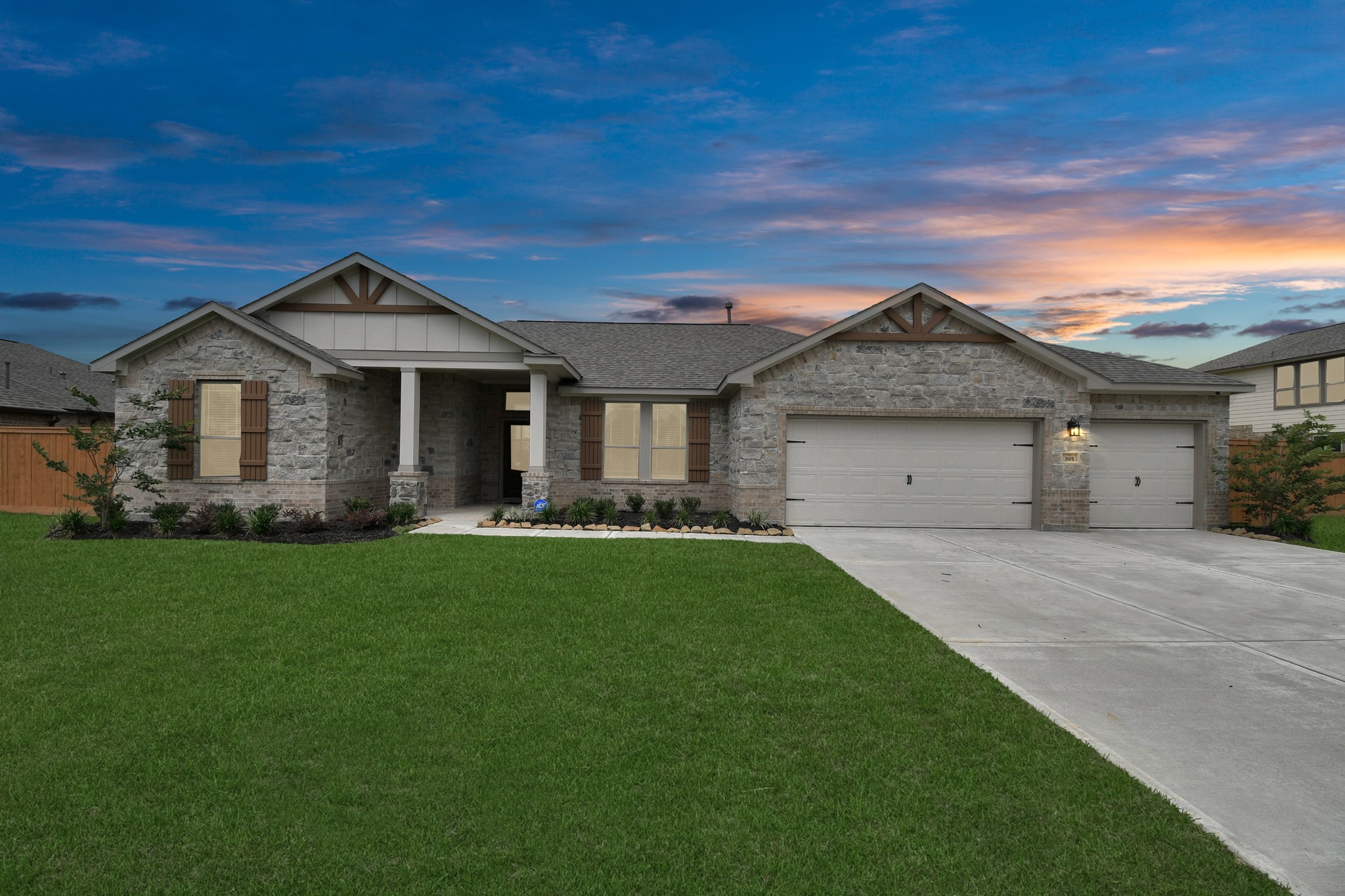 395 Hunter Ranch Way Dayton, TX 77535 - Photo 2 of 11 Welcoming front elevation with three car garage and spacious driveway