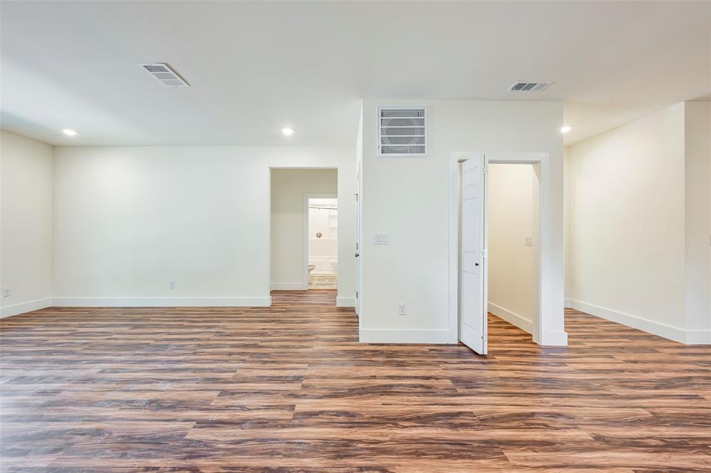 3525 Herrling Street Dallas, TX 75210 - Photo 11 of 28 a view of wooden floor and windows in a room