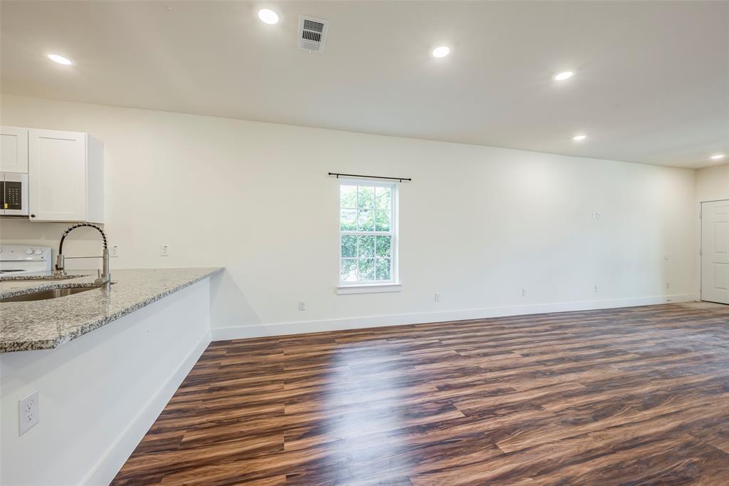 3525 Herrling Street Dallas, TX 75210 - Photo 13 of 28 a view of a kitchen with a sink and wooden floor