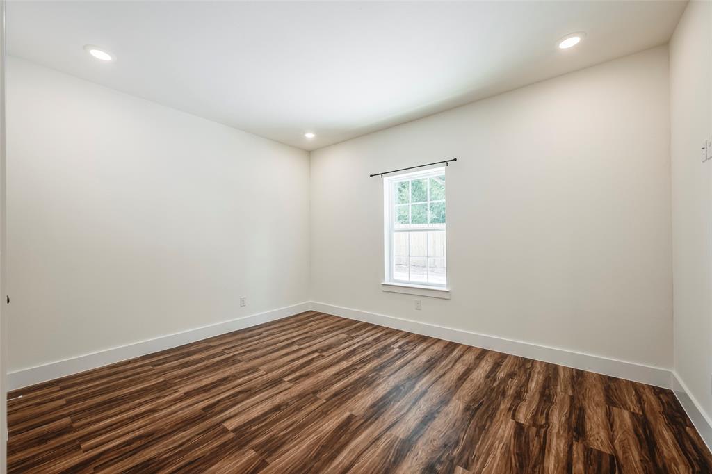 3525 Herrling Street Dallas, TX 75210 - Photo 19 of 28 wooden floor in an empty room with a window