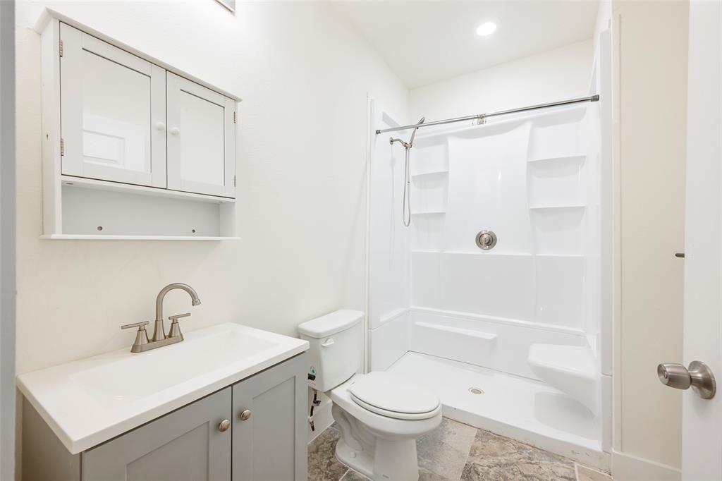 3525 Herrling Street Dallas, TX 75210 - Photo 24 of 28 a bathroom with a sink toilet and shower