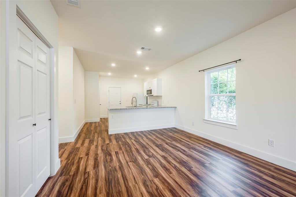 3525 Herrling Street Dallas, TX 75210 - Photo 10 of 28 a view of kitchen and hall with wooden floor