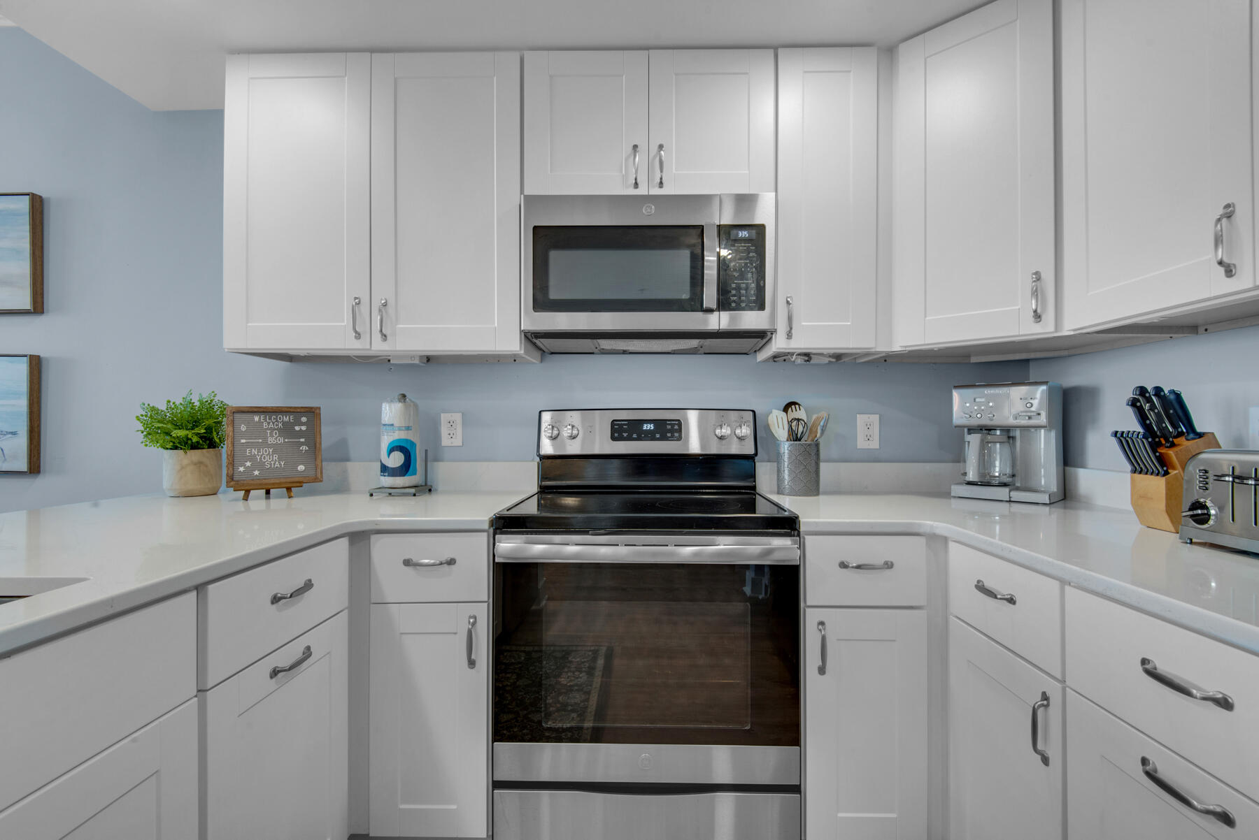 1110 Santa Rosa Boulevard, Unit B501 Fort Walton Beach, FL 32548 - Photo 17 of 51 a kitchen with white cabinets and appliances