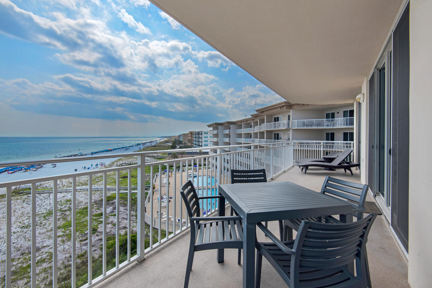 1110 Santa Rosa Boulevard, Unit B501 Fort Walton Beach, FL 32548 - Photo 19 of 51 a view of a balcony dining table and chairs