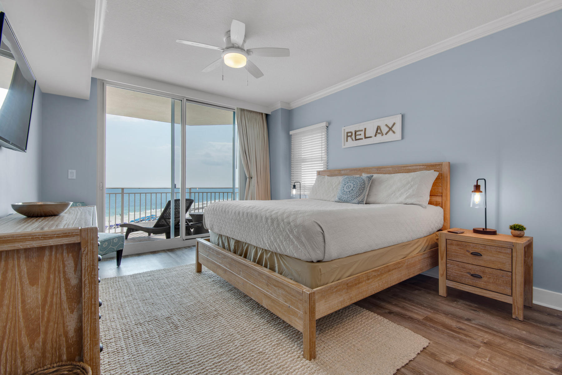 1110 Santa Rosa Boulevard, Unit B501 Fort Walton Beach, FL 32548 - Photo 24 of 51 a bedroom with a bed a couch and a chandelier