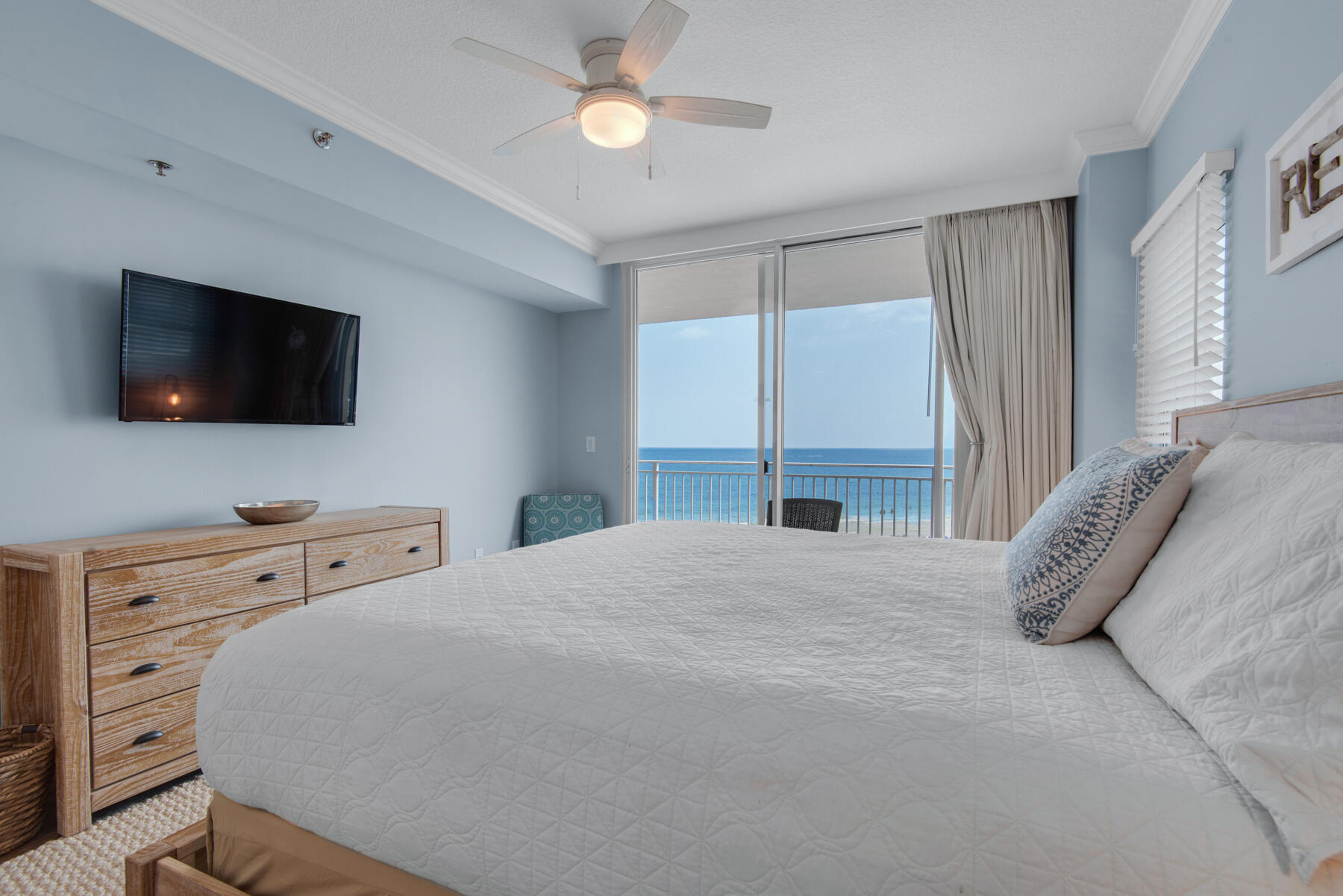 1110 Santa Rosa Boulevard, Unit B501 Fort Walton Beach, FL 32548 - Photo 25 of 51 a bedroom with a bed and a flat screen tv
