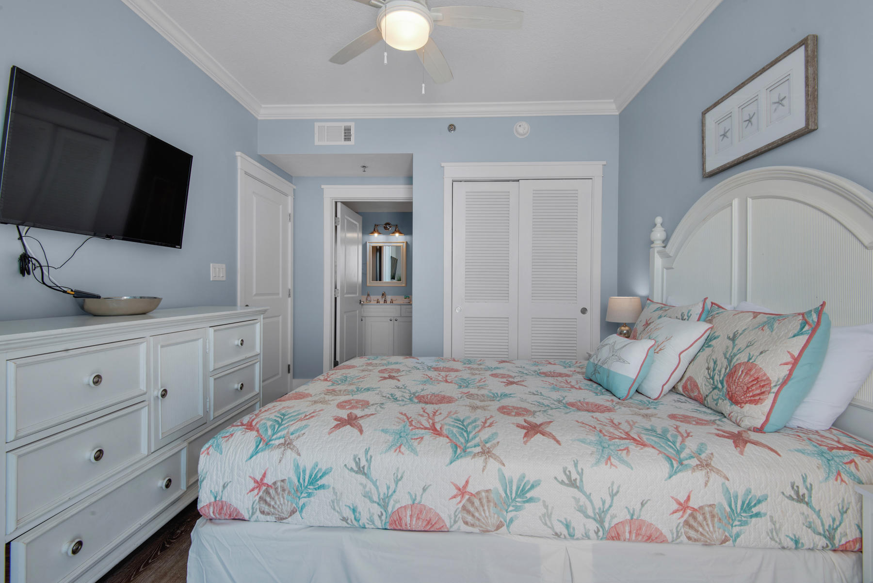 1110 Santa Rosa Boulevard, Unit B501 Fort Walton Beach, FL 32548 - Photo 33 of 51 a bedroom with a large bed and a flat screen tv