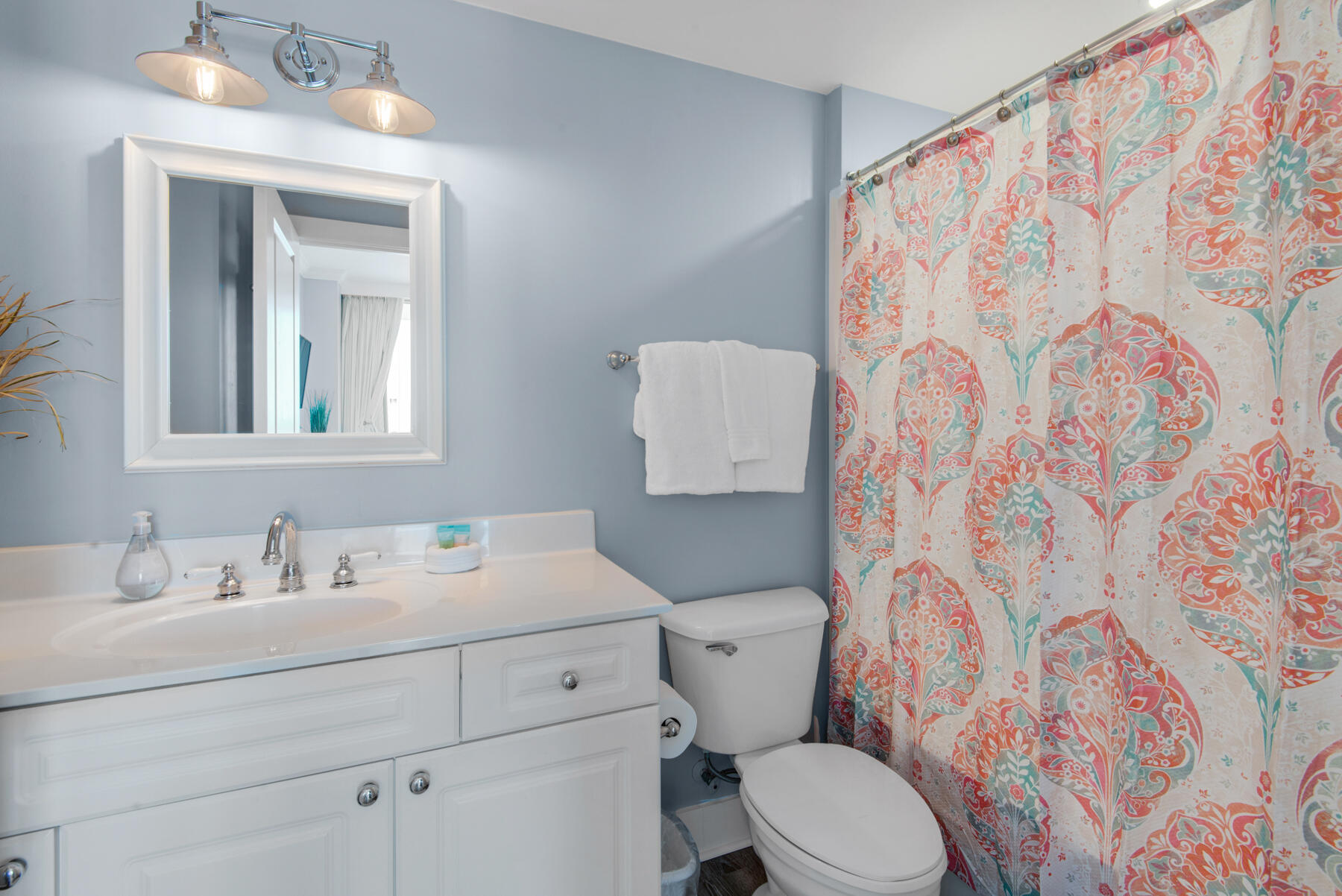 1110 Santa Rosa Boulevard, Unit B501 Fort Walton Beach, FL 32548 - Photo 34 of 51 a bathroom with a toilet sink and mirror